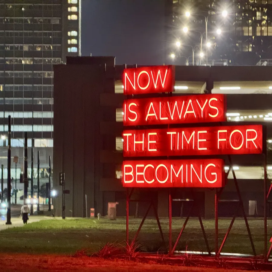 A red neon sign in the Arts District which reads NOW IS ALWAYS THE TIME FOR BECOMING